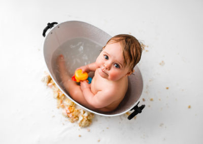 Barnsley cake smash session with baby splashing in the tub