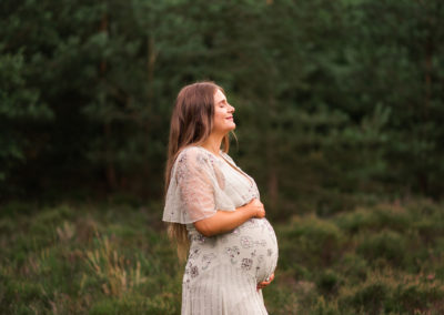Maternity photographer in Barnsley, mum smiling and taking it all in, photographed in nature