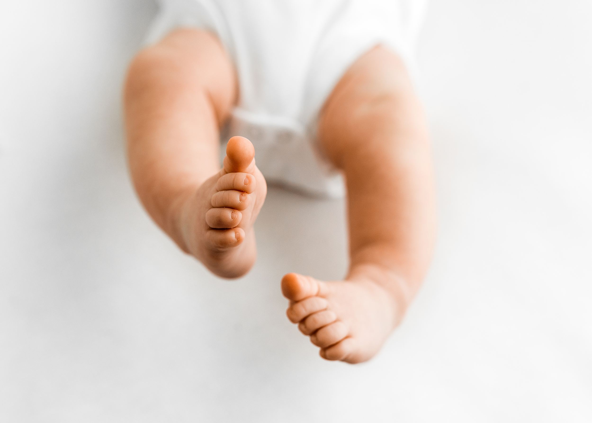 newborn photographer Barnsley, baby kicking it's feet