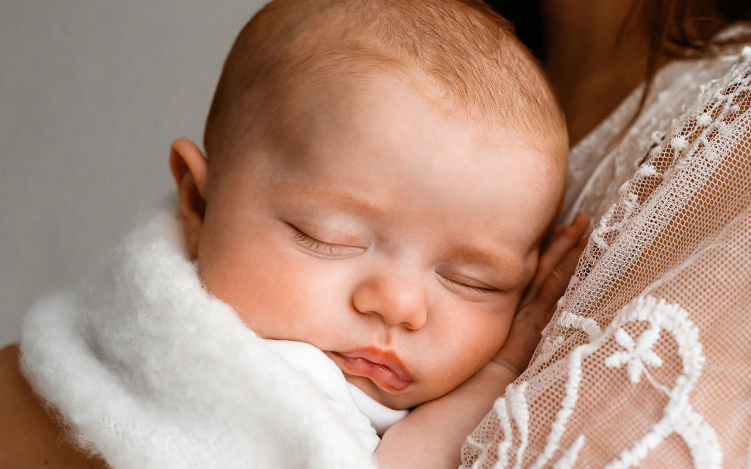 Barnsley photographer with baby sleeping in mums arms