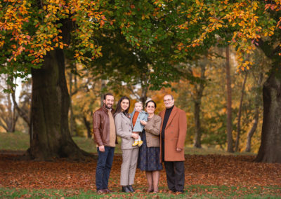 Family posing in an autumn setting at a Barnsley family photoshoot