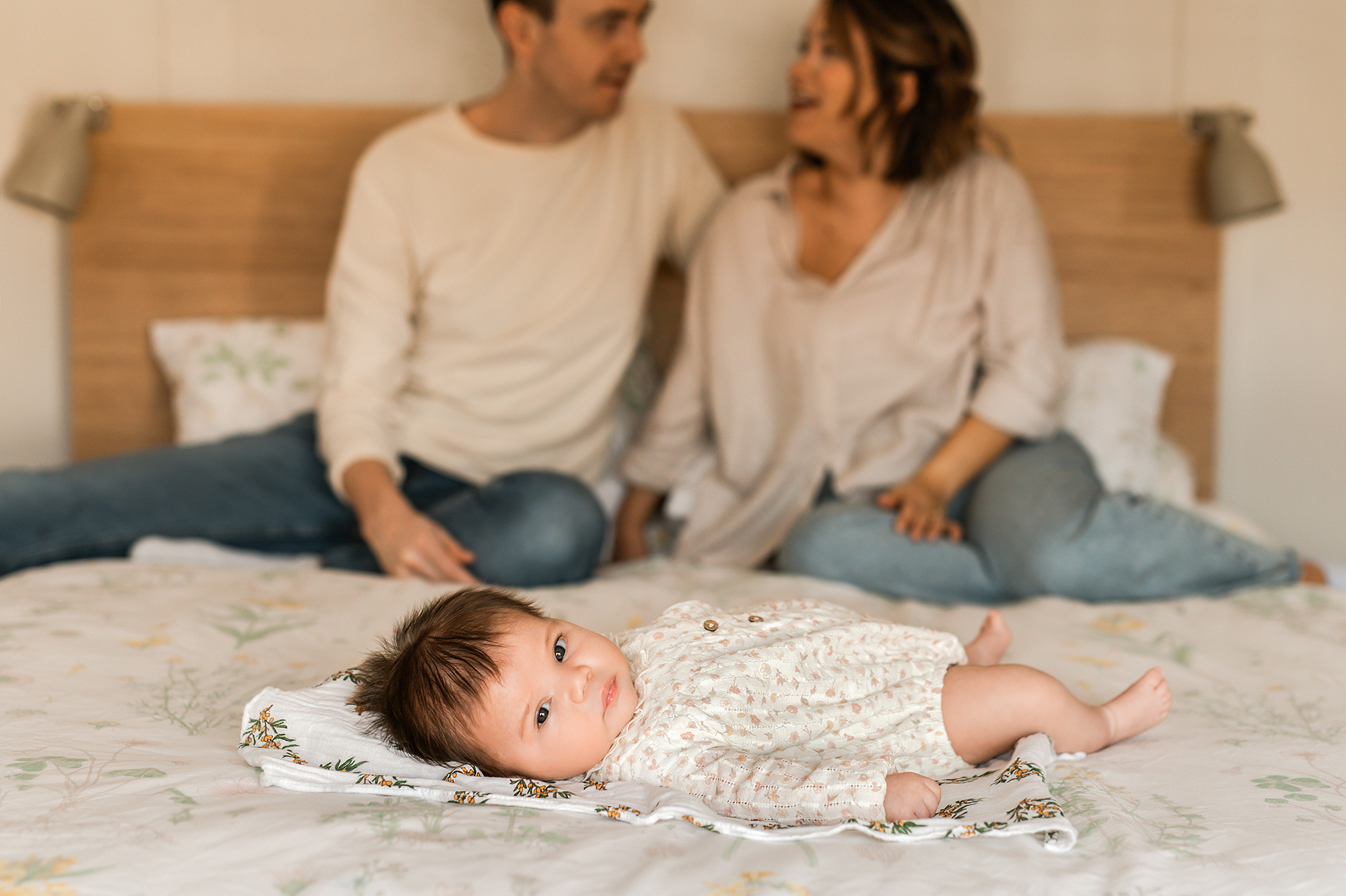 baby at the bottom of the bed, lifestyle newborn photographer Barnsley