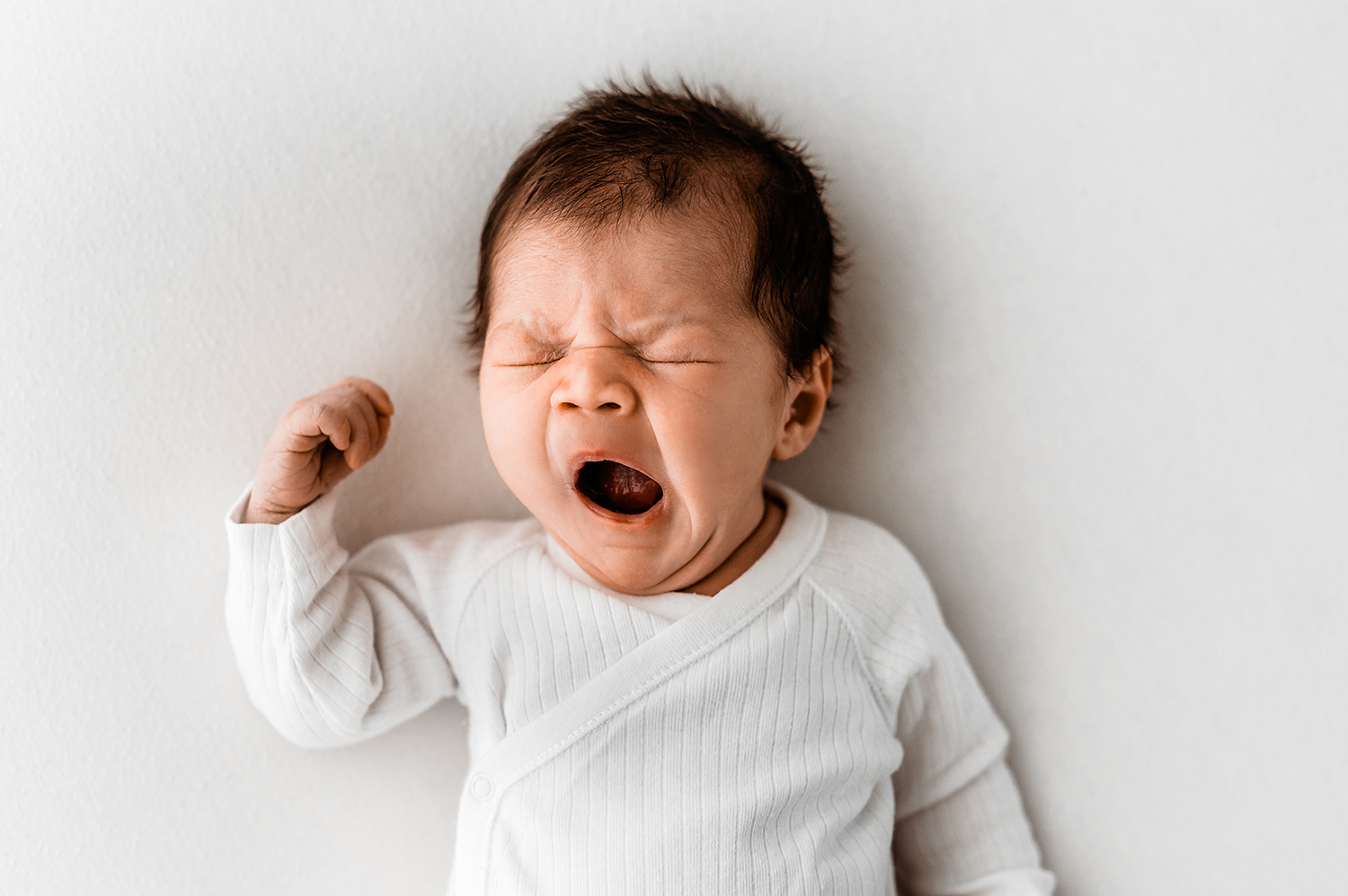 baby yawn at newborn session in Barnsley photography studio