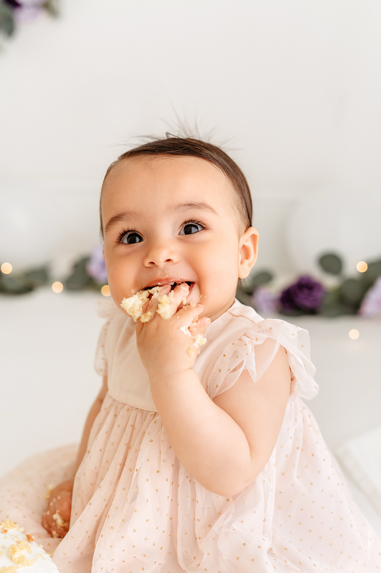 photoshoot with mamas & papas - baby girl close up of eating cake