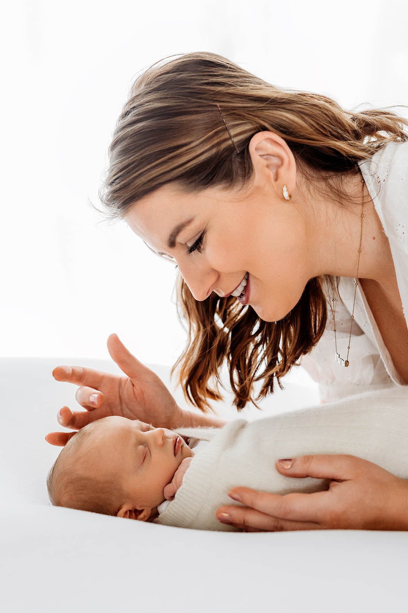 Mum admiring baby with newborn photographer Barnsley